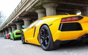 Обои четыре супер кара, авто Lamborghini возле моста на рабочий стол