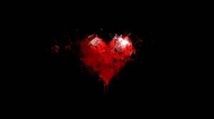 Обои красное сердце нарисованное краскам на черном фоне на рабочий стол