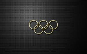 Обои золотые олимпийские кольца на черном фоне на рабочий стол