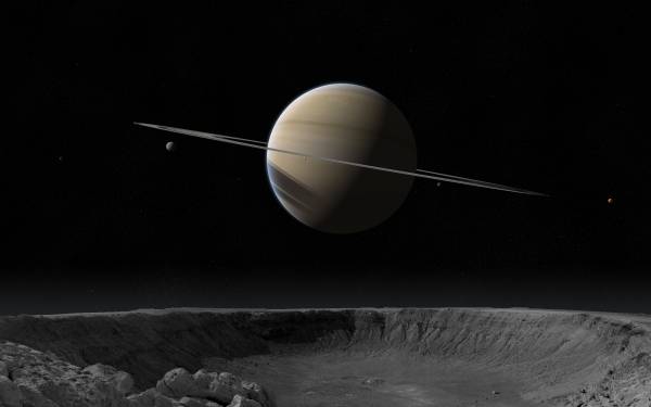 планета Сатурн фото возле кратера луны обои для рабочего стола