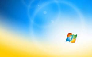 Обои эмблема ОС Windows 7 на сине-желтом фоне на рабочий стол